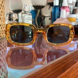 Orange clear plastic square sunglasses by Powder UK